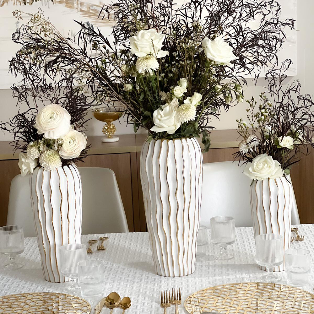 Elegant White Porcelain Vase with Gold Wavy Design